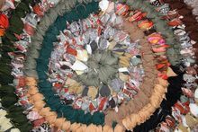A photo of a circle rag rug, which has been made via recycling