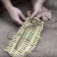 Simple shoes being made by hand with found plant materials