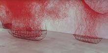 Art installation with red string